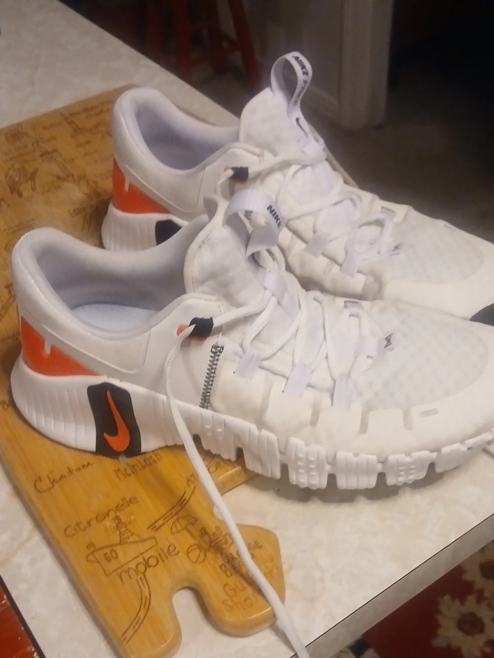 Nike Men’s White Athletic Shoes with Orange and Black Accents